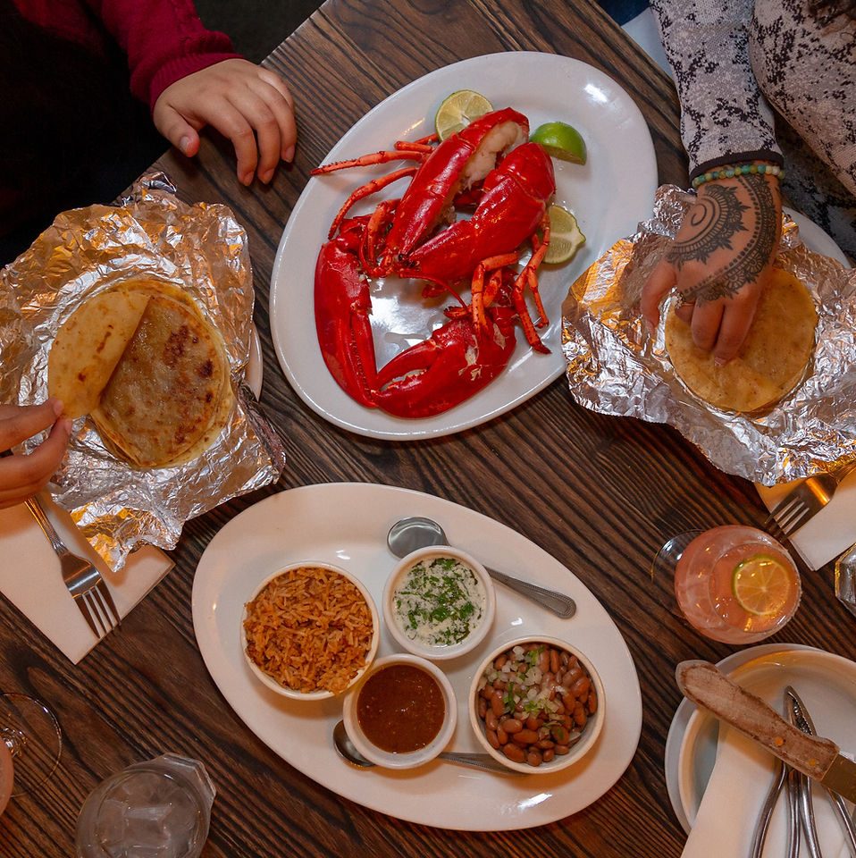 Puerto Nuevo lobster with handmade flour tortillas, rice, beans and salsas at Don Pisto's